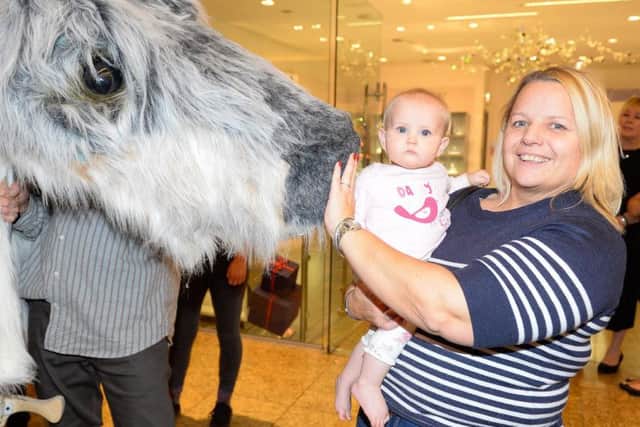 Oh baby, look at this for a first Christmas surprise - families can get up close to meet the reindeer puppets paraded daily at Sheffield's Meadowhall
