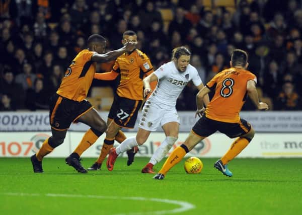 Leeds' Luke Ayling is outnumbered by the Wolves defence.  Picture: Tony Johnson.