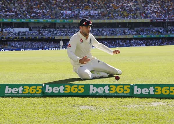 England's Dawid Malan saves a boundary during day two of the Ashes Test match at The Gabba, Brisbane. (Picture: Jason O'Brien/PA Wire)