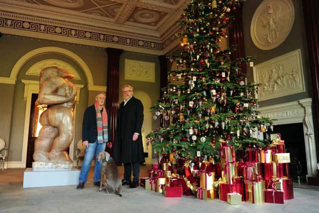 Harewood House's Lord Harewood David Lascelles with his dog Isla, and decorations designer Michael Howells. Picture by Simon Hulme