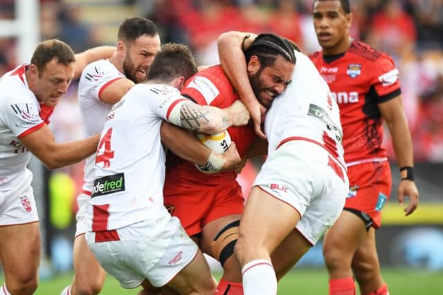 Konrad Hurrell is tackled by
England's players during Saturday's semi-final at the Mt Smart Stadium, Auckland Picture: Andrew Cornaga/SWpix.com/PhotosportNZ