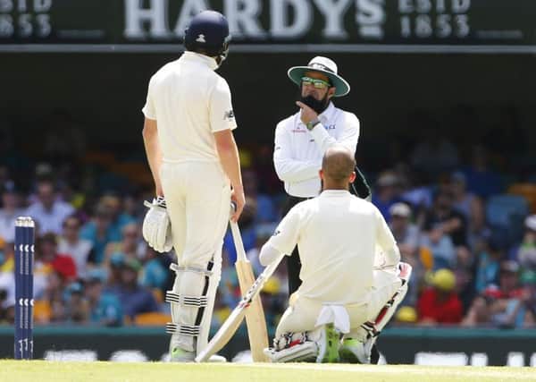 England's Moeen Ali looks at umpire Aleem Dar as he awaits a 3rd umpire decision during day four of the Ashes Test match at The Gabba, Brisbane. (Picture:: Jason O'Brien/PA Wire)