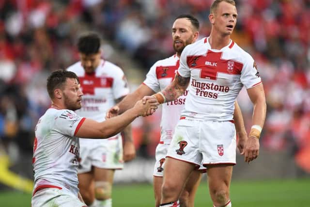 Elliott Whitehead and Kevin Brown shake hands after the semi-final victory over Tonga.