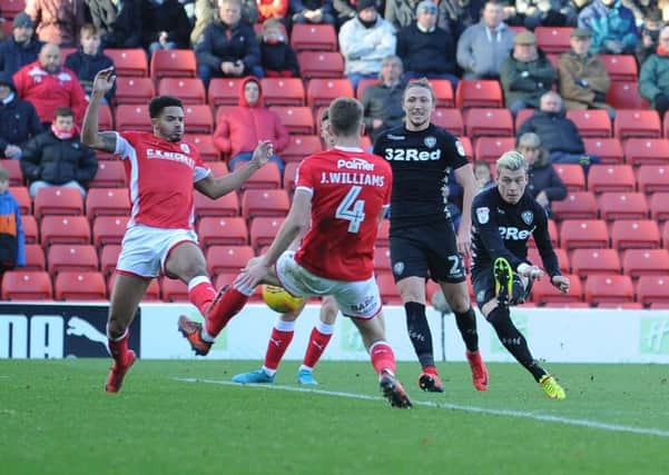 PICK THAT ONE OUT: Gjanni Alioski, right, doubles Leeds United's lead with a stunning strike against Barnsley at Oakwell. Picture by James Hardisty.
