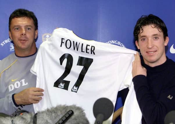 New signing Robbie Fowler is unveiled by David O'Leary in 2001.