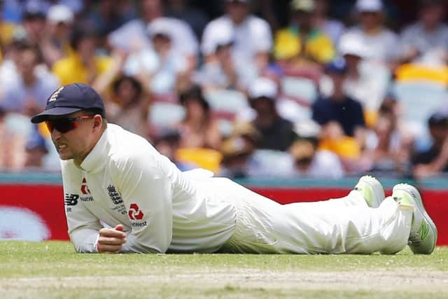England's Joe Root looks dejected in the field during day five at The Gabba: Jason O'Brien/PA