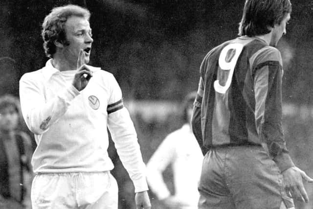 Billy Bremner lets Johan Cruyff know who's boss as Leeds United take on Barcelona in 1975.