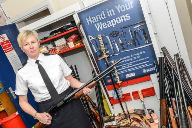 West Yorkshire Police Assistant Chief ConstableCatherine Hankinson with some of the surrendered weapons.