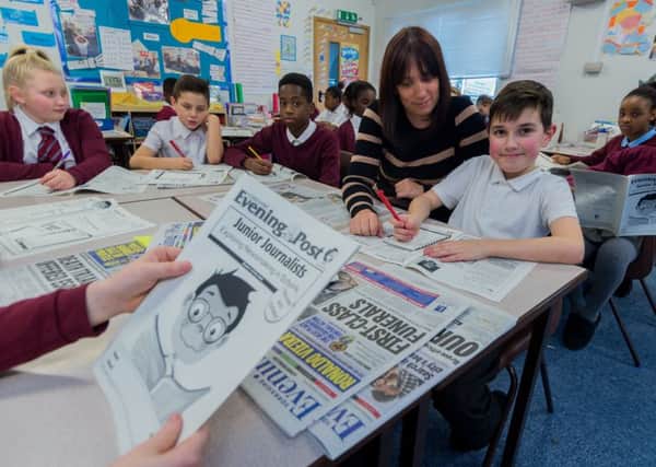 TOP MARKS: Pupils from St Philips Catholic Primary with deputy head Hannah Taylor. PIC: James Hardisty