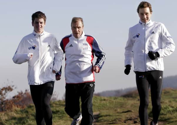 INSPIRATIONAL: Jonathan, left, and Alistair Brownlee on Otley Chevin with coach Malcolm Brown.  PIC: Lorne Campbell/Guzelian