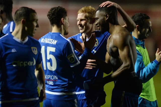 Guiseley players celebrate beating Accrington Stanley in the first round of the FA Cup.