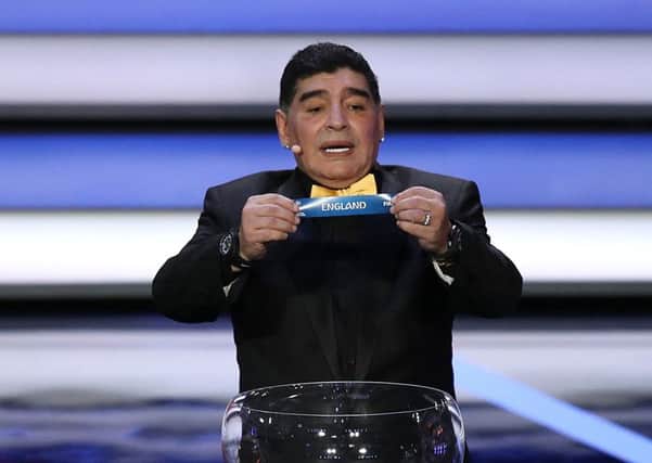 World Cup 2018 draw ambassador Diego Maradona pulls England out the pot to be included in group G. Picture: Nick Potts/PA