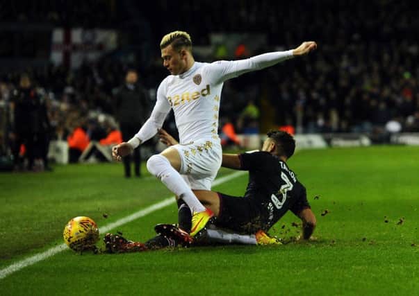 IN TOUCH: Leeds United's Gianni Alioski is tackled by Aston Villa's Neil Taylor.
 Picture: Jonathan Gawthorpe.