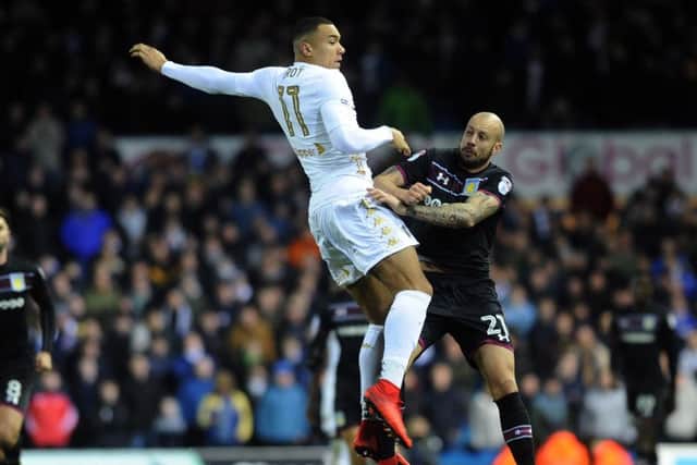 UP FOR IT: Leeds 
United's Jay-Roy Grot battles with Aston Villa's Alan Hutton.
 Picture: Jonathan Gawthorpe.