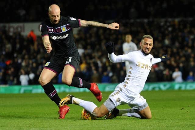 OVER YOU GO: Leeds United's Kemar Roofe is brought down by Aston Villa's Alan Hutton.
 Picture: Jonathan Gawthorpe.