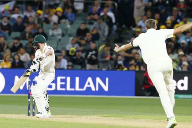 GOT HIM: England's Craig Overton takes the prized wicket of Australia captain Steve Smith on a tense day one of the Ashes Test match at the Adelaide Oval. Picture: Jason O'Brien/PA