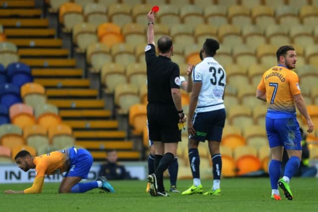 Referee Carl Boyeson sends off Guiseley's Chris M'Boungou PIC: Jonathan Gawthorpe