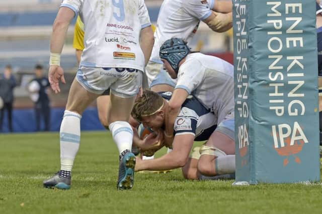 Joe Buckle scores one of his three tries