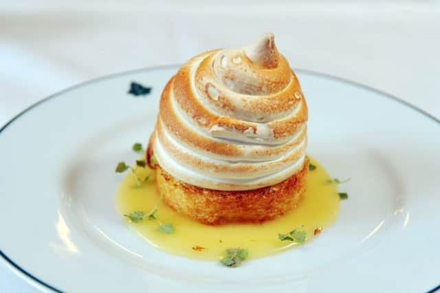 LEMON MERINGUE ALASKA: Baked meringue with lemon ice cream, lemon curd sauce and baby basil. PIC: Tony Johnson