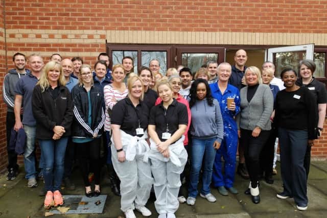 Employees from NestlÃ©  Professional and Orchard Care Homes, outside Paisley Lodge, in Leeds.