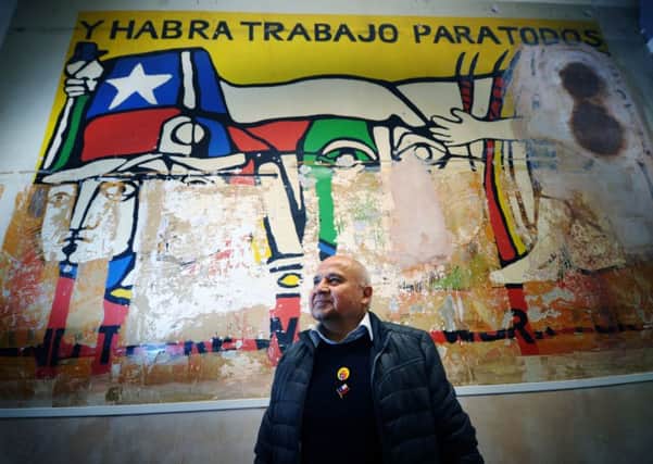 Gilberto Hernandez, one of the Chilean exiles who worked on the artwork, pictured with the mural. PIC: Jonathan Gawthorpe