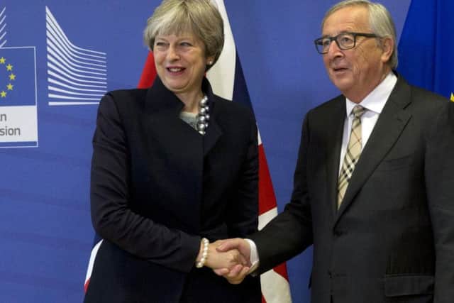 Theresa May and Claude Juncker strike a deal...
