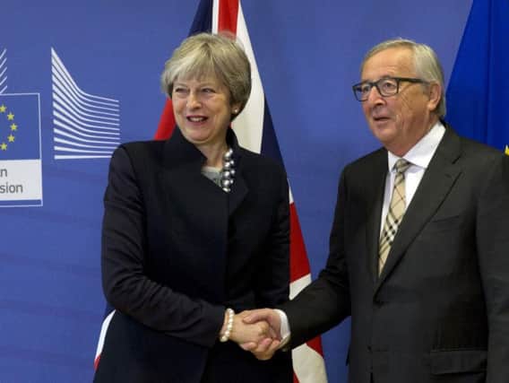 Theresa May and Claude Juncker strike a deal...