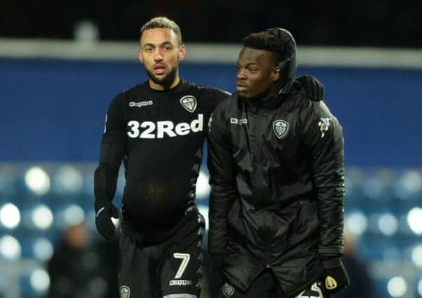 HAT-TRICK HERO: Leeds United's Kemar Roofe, left, leaves with the match ball alongside Ronaldo Vieira. Picture by Bruce Rollinson.