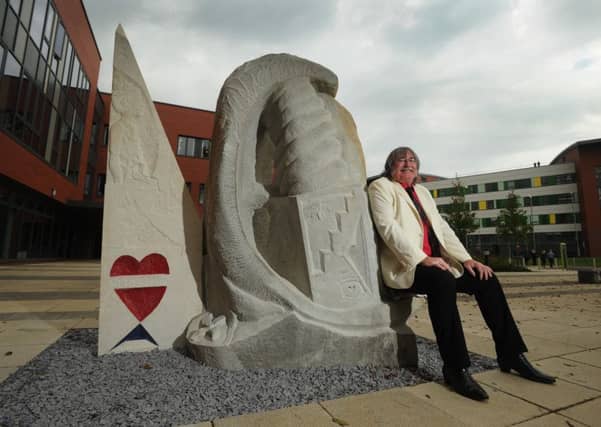 Stephen Hines with his sculpture 'The Tree of Life' outside Pinderfields Hospital.