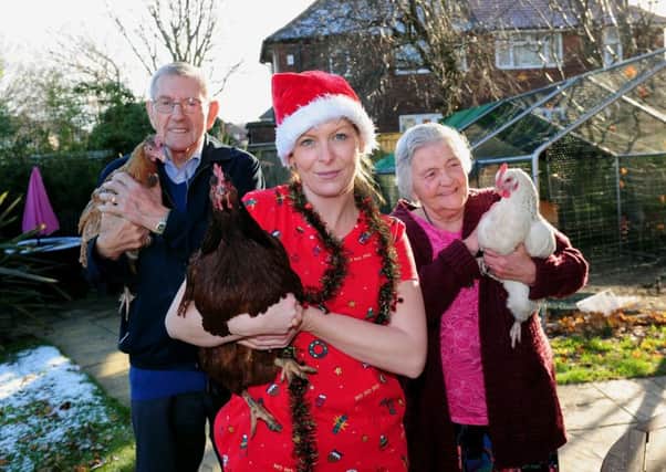 Dani Bird with the three hens and residents Ted Wilkinson, 89, and Lilian Gale, 83. Picture: Simon Hulme