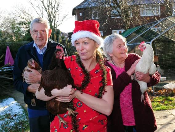 Nesfield Cafe Home residents Ted Wilkinson, 89 and Lilian Gale, 83, with events co-odinator for Orchard Care Homes, Dani Bird, centre, holding some of the chickens provided by the HenPower Project