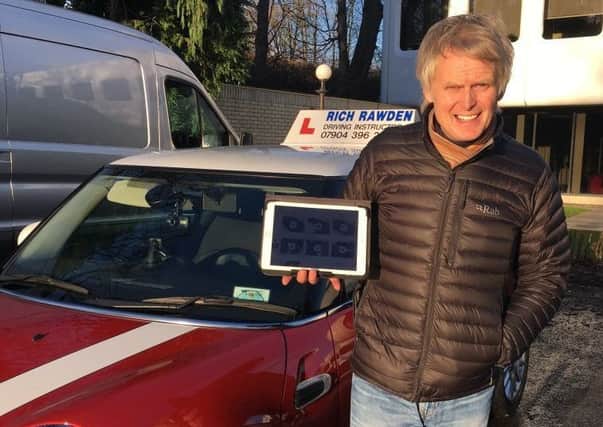 TECHNOLOGY: Driving instructor Richard Rawden displaying the new driving test app he has created.
