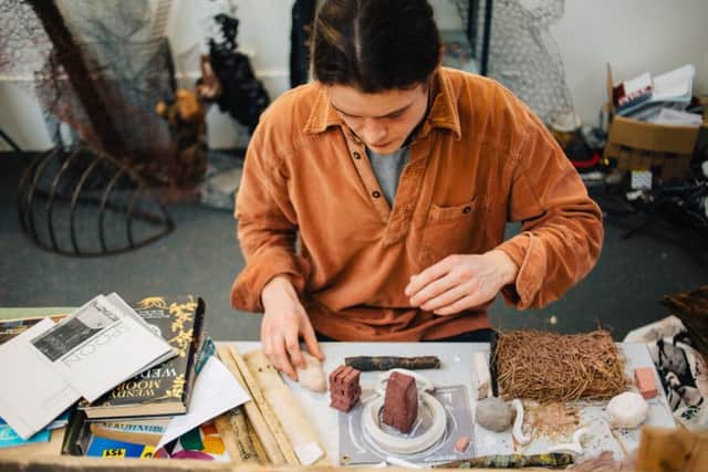 BEHIND THE SCENES: Student Richard Stringer who created thatched roofs used to create a Victorian Irish farm.