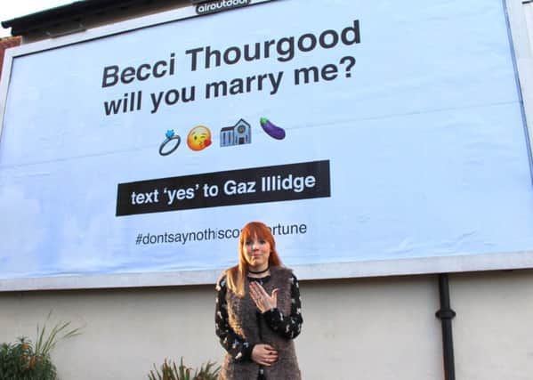 ROMANTIC: Becci Illidge at the billboard.