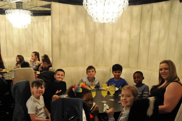 Pupils from  Low Road  Primary School from Hunslet  in Leeds  at the Mission Christmas lunch at Gaucho's restaurant in Leeds