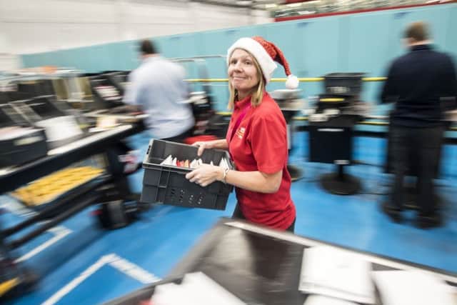 Royal Mail employee Jane Carroll at the Royal Mail Leeds Mail Centre. Danny Lawson/PA Wire