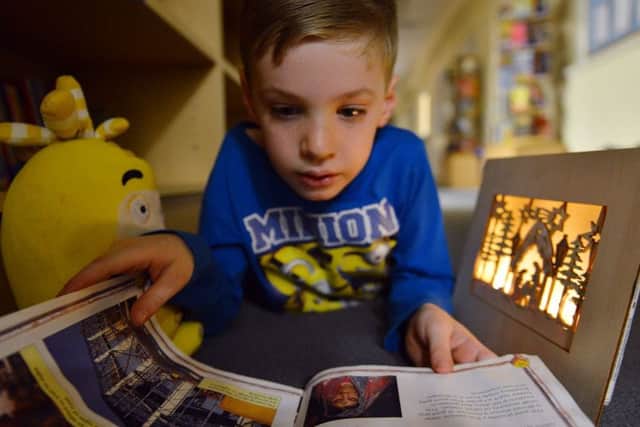 BEDTIME ROUTINES: Reading can help sleepy children at bedtime.