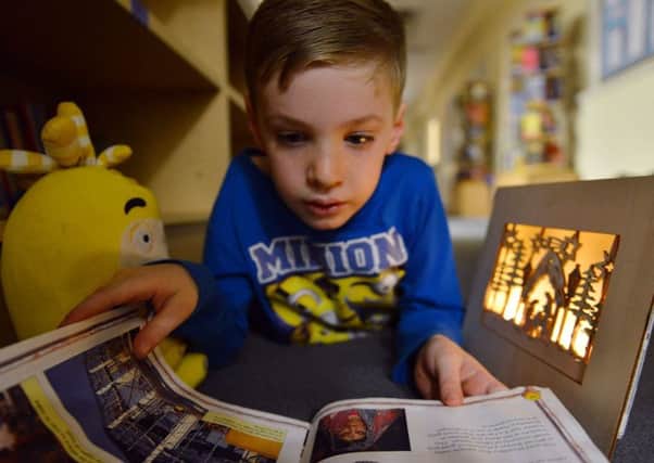 BEDTIME ROUTINES: Reading can help sleepy children at bedtime.