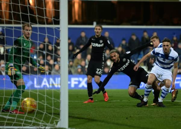 Kemar Roofe heads in Leeds United's first goal at 
Queens Park Rangers.