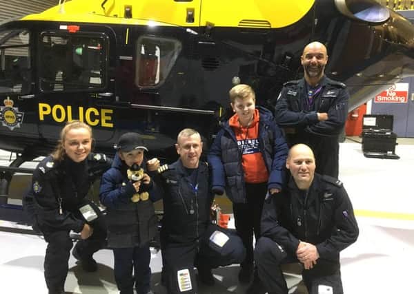 MISSION: Ethan Docherty (second left) enjoys his special mission with West Yorkshire Police.