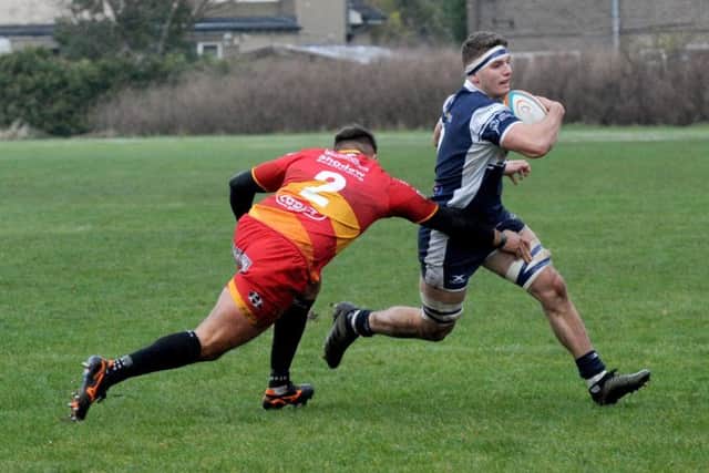 Josh Bainbridge of Carnegie goes past Ellis Shipp of Dragons Premiership Select.