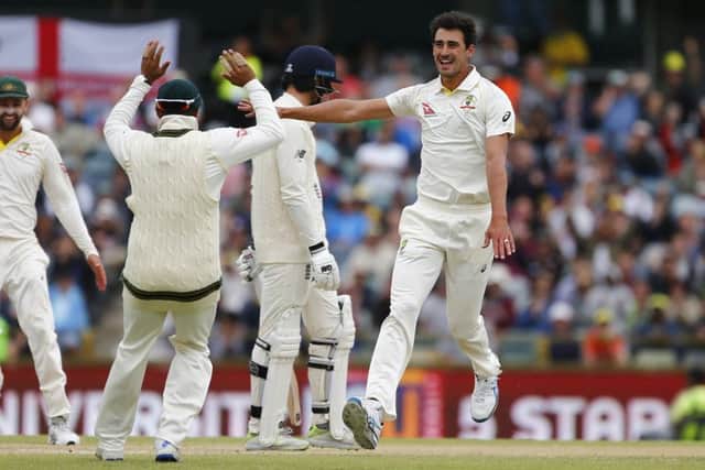 ALL ENDS UP: Australia's Mitchell Starccelebrates the wicket of England's James Vince with his team-mates at the WACA. Picture: Jason O'Brien/PA