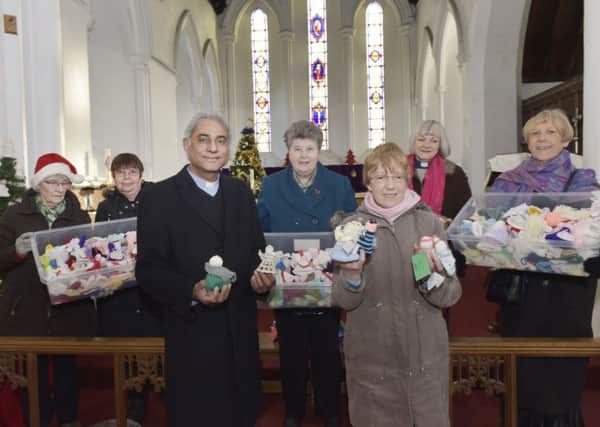 Knitters with their Angels, from left,  Margaret O;Toole, Margaret Carry, Rev Dominic Mughal, Linda Calvert Catherine Coates, Rev Susan Greenhart,  Hilary Kitching