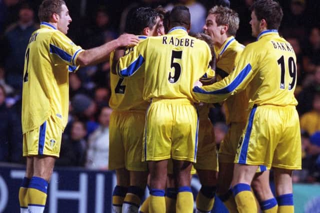 Leeds players mob Stephen McPhail aftre his second goal at Chelsea  gave Leeds victory.