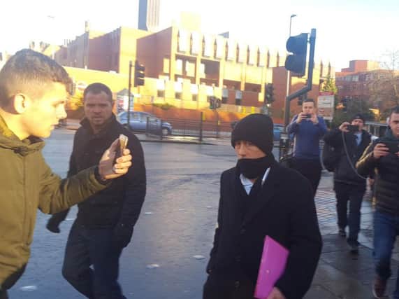 Kieran Creavan (centre) is filmed by a member of the Predator Exposure group (left) outside Leeds Crown Court, where he has admitted sex offences after he was confronted by the so-called paedophile hunters when he travelled to the UK to meet what he thought was a 13-year-old girl.