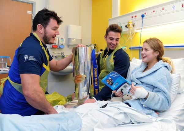 SPECIAL VISITS: Leeds Rhinos stars meet Brett Ferres and Jack Walker with Evie Fenton, 15, during their visit to Leeds General Infirmary. PIC:  Jonathan Gawthorpe