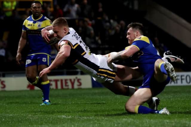 Mikolaj Oledski, scoring the Rhinos' 11th try against Challenge Cup foes Doncaster on his first-team debut. PIC: Bruce Rollinson