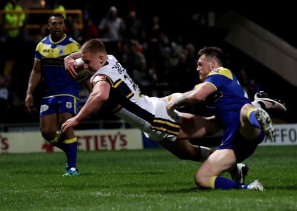 Mikolaj Oledski, scoring the Rhinos' 11th try against Challenge Cup foes Doncaster on his first-team debut. PIC: Bruce Rollinson