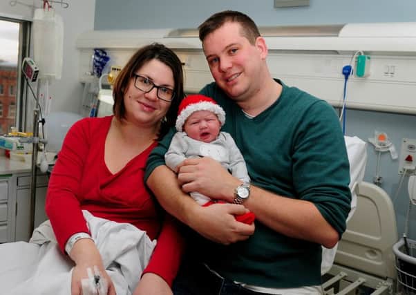 Charlotte Sinclair and Matthew Tindall pictured with their Christmas Day baby Eliza. PIC: Simon Hulme