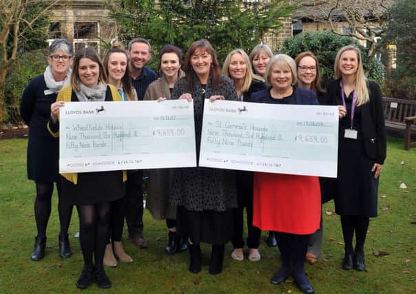 19 December 2017......    Editor of the YEP, Hannah Thaxter presents over Â£19,000 raised through the YEP Half and Half appeal to hospice representatives  Kate Bratt-Farrar from Wheatfields  and Tracey Dick from St Gemma's together with the hospices staff members. Picture Tony Johnson.